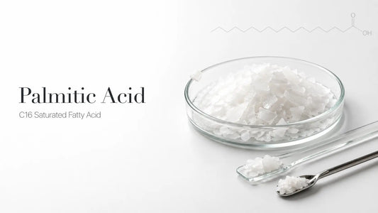Bio Shop™ cosmetic-grade Palmitic Acid white flakes in glass petri dish on marble — for DIY soap and skincare in Pakistan