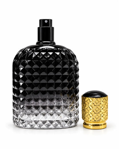 Luxury 100ml empty perfume bottle featuring geometric diamond patterned glass, clear base, smooth black front panel and decorative gold cap for perfume making.