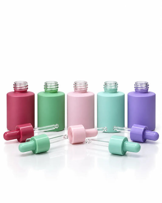 30ml pastel serum dropper bottles in purple, green, mint and pink on white background