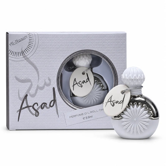 2. Asad 9.9ml attar by Al-Nuaim in coordinated white and silver bottle-and-box packaging.
