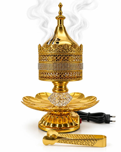 Luxury golden electric bakhoor burner set with decorative lid, crystal-style center and golden tong on white background