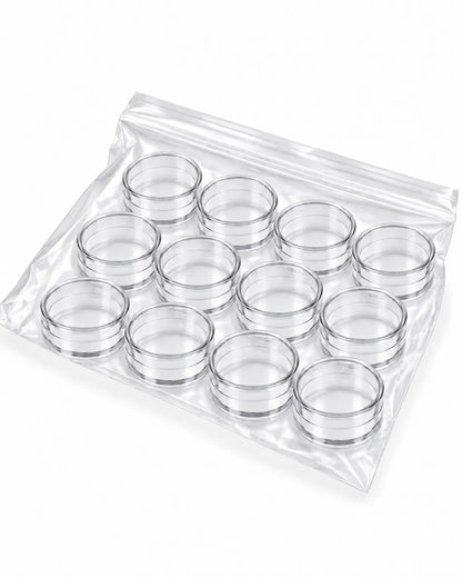 12 clear empty 5gm round cosmetic sample jars without lids on white background