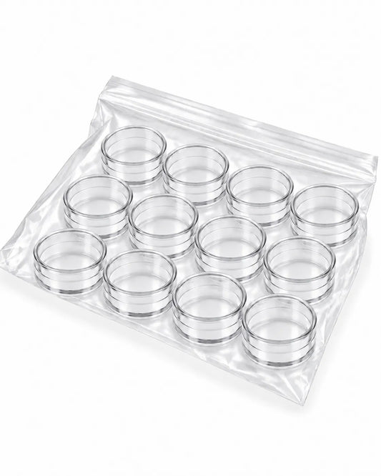12 clear empty 5gm round cosmetic sample jars without lids on white background