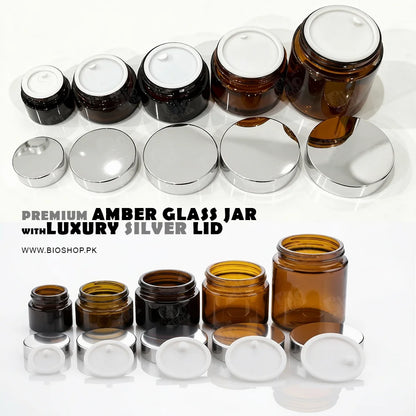 Amber glass jars with silver lids on a white background, featuring the brand 'Bioshop'.