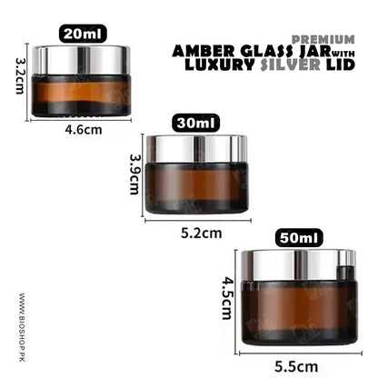 Amber glass jars with luxury silver lids and measurements on a white background