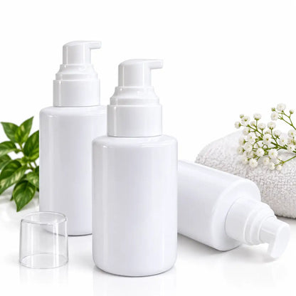 White cosmetic pump bottle showing pump dispenser, bottle neck and pump components