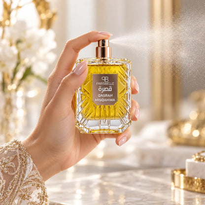 Parisbelle Qasrah Misqahwa 100ml perfume bottle with golden-yellow liquid and a clear geometric cap