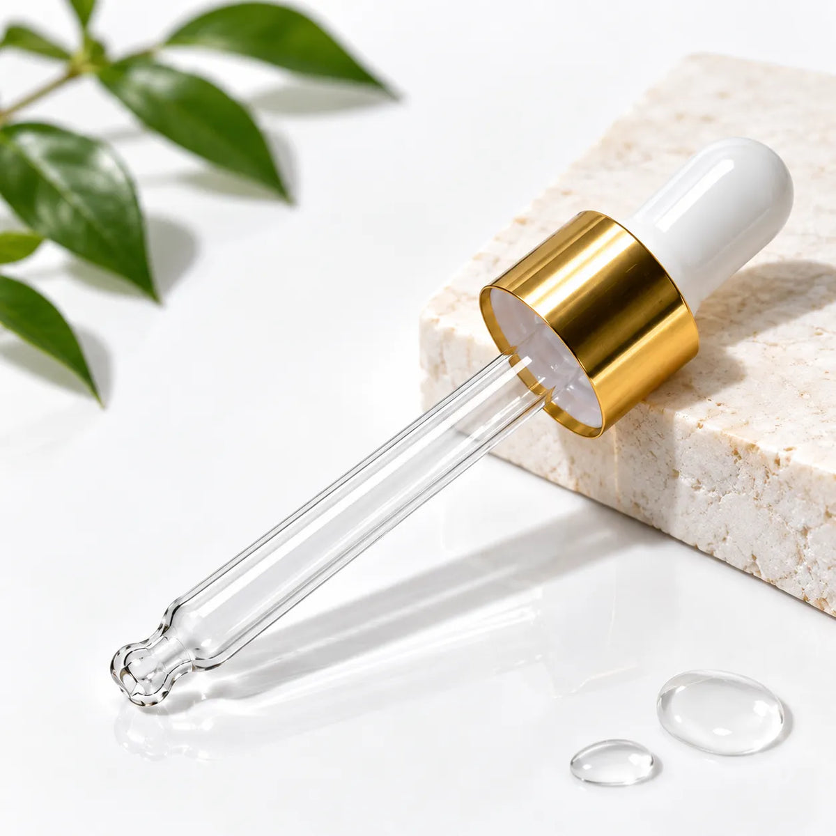 Cosmetic bottle dropper with golden collar and white rubber top Bio Shop Pakistan