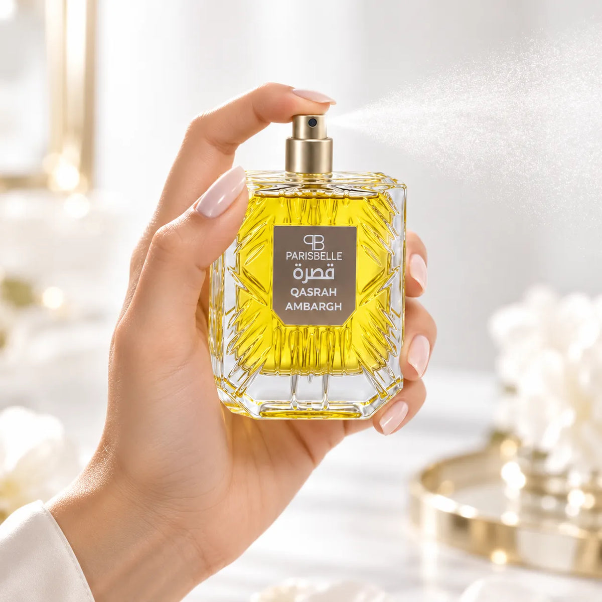 Parisbelle Qasrah Ambargh perfume with golden-yellow liquid visible through its presentation box