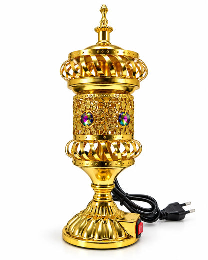 Golden electric bakhoor burner with floral openwork, multicolour accents, a tall finial lid, pedestal base and black power cord.
