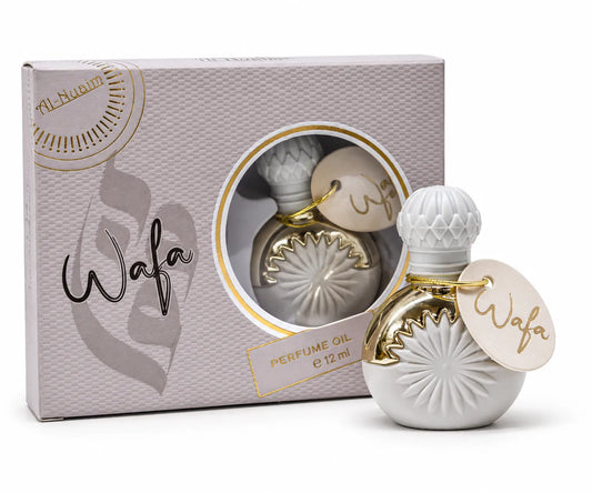 Wafa attar bottle with a gold cord name tag inside a pale textured display box.