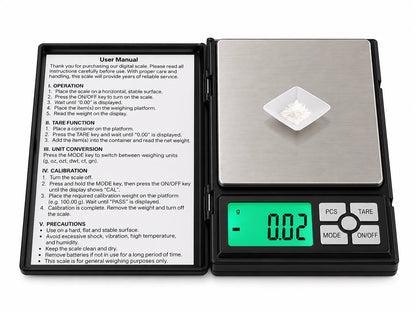Black digital pocket weighing scale with protective flip cover and stainless steel platform on white background – Bio Shop™ Pakistan.