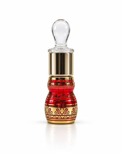 Premium 6ml Arabic attar bottle showing glass stick applicator and decorative gold details