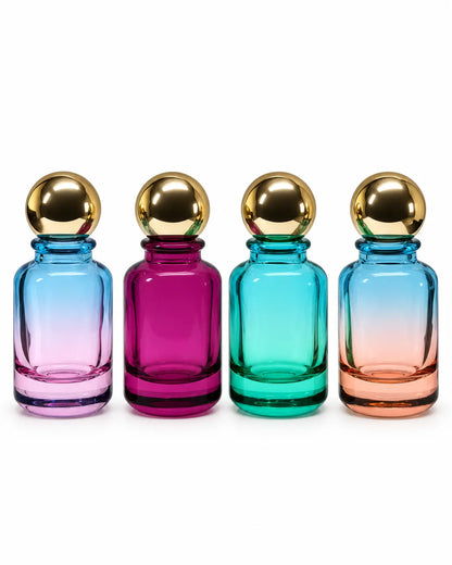 Four 50ml coloured glass crimping perfume bottles with gold ball caps in blue-pink, magenta, aqua green and blue-peach