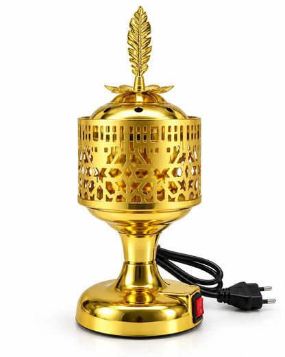golden electric incense burner with a leaf-shaped finial, star-pattern body, red switch and rounded base.